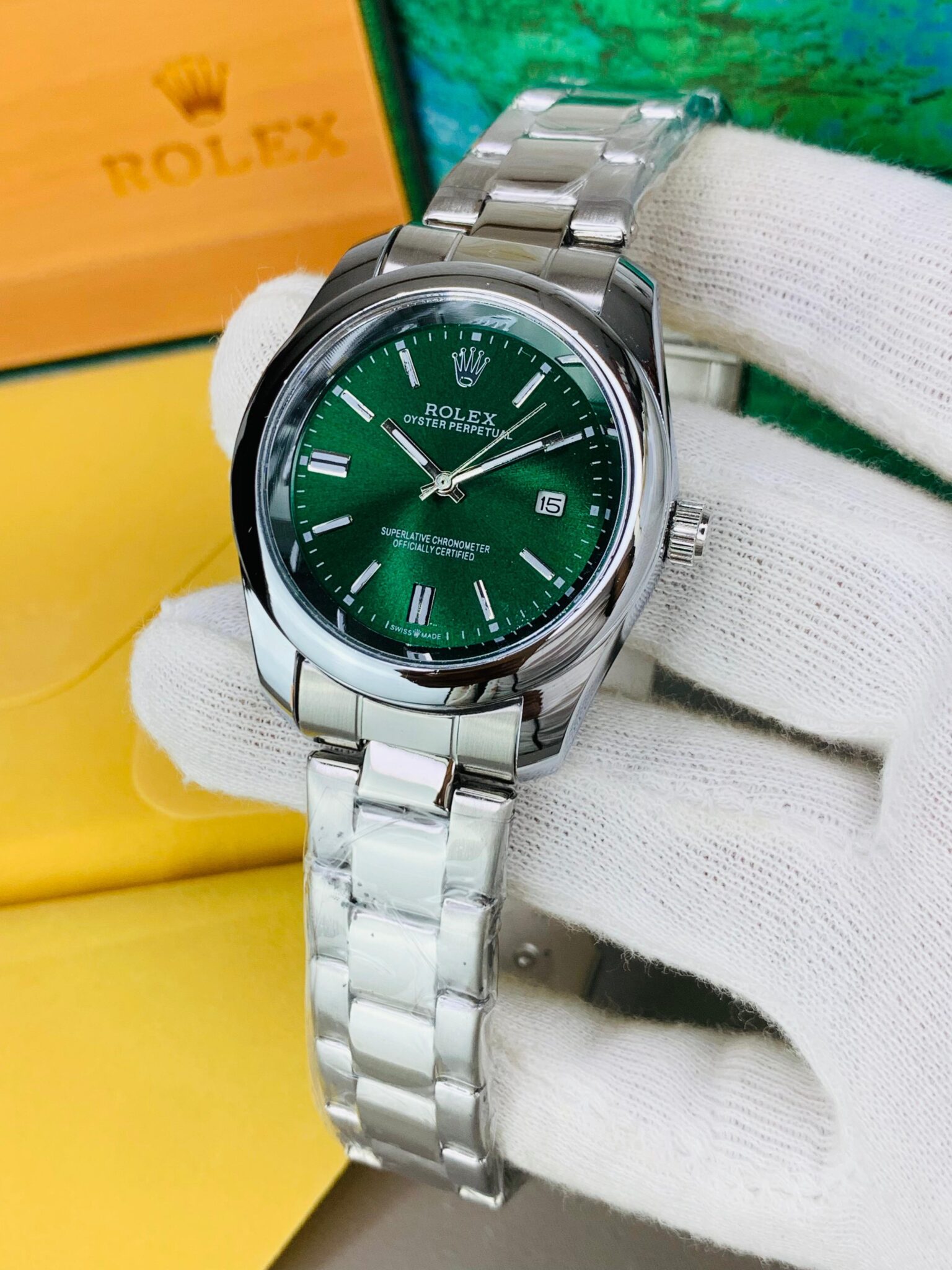 Silver with green dail